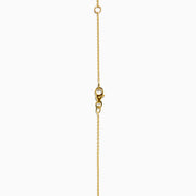 The 14K Yellow Gold Diamond Spike Collarbone Necklace features alternating clear diamonds and gold spike accents on a delicate gold chain.