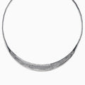 The 925 Sterling Silver Diamond Accented Necklace is a modern, elegant piece with a textured, curved front and sparkling stones on a sleek segmented band.