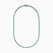 The 925 Sterling Silver Emerald and Diamond Tennis Necklace showcases a sleek row of oval green emeralds and sparkling diamonds set in sterling silver, beautifully arranged against a crisp white background.