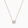 The Novelty 14K Rose Gold Diamond Crown Necklace features a delicate chain and crown-shaped pendant adorned with small sparkling stones, a heart motif at the center, and a single larger stone at the top.
