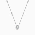 The Pave Classica 14K White Gold Diamond Oval Necklace features an oval pendant encrusted with diamonds and extra sparkling stones spaced along the chain, creating a delicate and elegant look.