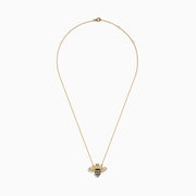 The 14K Yellow Gold Black and White Diamond Bee Necklace features a gold chain with a bee pendant adorned with black and white diamond accents, delicate stripes, and intricate detailing on the head and body. The pendant is symmetrically suspended from the elegant chain in classic Effy style, adding a touch of whimsical elegance.