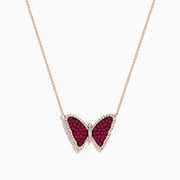 The Ruby Royale 14K Rose Gold Ruby Butterfly Necklace features a butterfly pendant with vivid red and black stones, accented by clear crystals on a delicate rose gold chain.