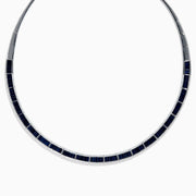 The Royale Bleu 14K White Gold Blue Sapphire and Diamond Necklace features rectangular blue sapphires in a row, bordered by sparkling diamonds in a semi-rigid collar design.
