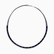The Royale Bleu 14K White Gold Blue Sapphire and Diamond Necklace features rectangular blue sapphires in a row, bordered by sparkling diamonds in a semi-rigid collar design.