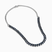 The 14K White Gold Blue Sapphire and Diamond Leaf Motif Necklace showcases a graceful, leaf-inspired design with alternating rows of blue sapphires and diamond accents for a sparkling, elegant look.