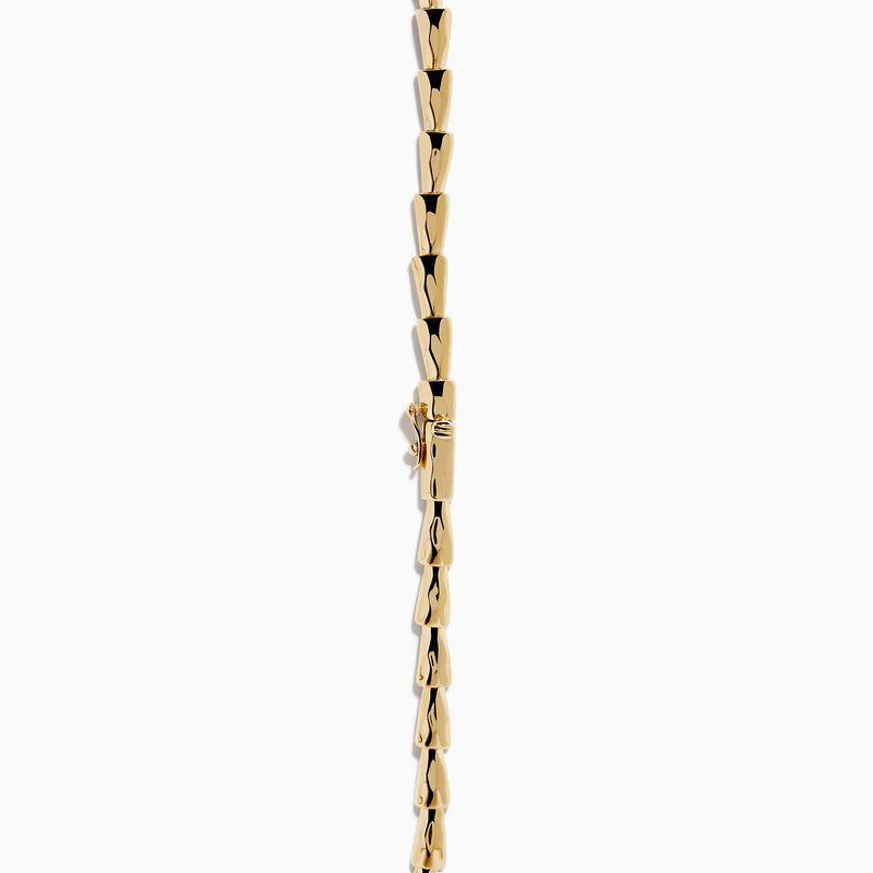 The Signature 14K Yellow Gold Diamond and Tsavorite Panther Necklace features angular links and two detailed panther head motifs with tsavorite eyes and diamond accents at the center, facing each other to form the clasp.