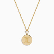 The Zodiac 14K Yellow Gold and Diamond Gemini Necklace features a round pendant with an engraved Gemini design, highlighted by sparkling diamonds for an elegant, refined look.