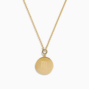 The Zodiac 14K Yellow Gold and Diamond Scorpio Necklace features a round pendant with an ornate Scorpio symbol bordered by sparkling diamonds.