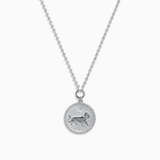 The Zodiac 925 Sterling Silver and Diamond Leo Necklace features a round pendant with an engraved lion on a beaded chain, displayed against a white background.
