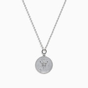 The Zodiac 925 Sterling Silver and Diamond Scorpio Necklace features a round, textured pendant with an engraved scorpion design, hanging from a beaded chain against a white background.