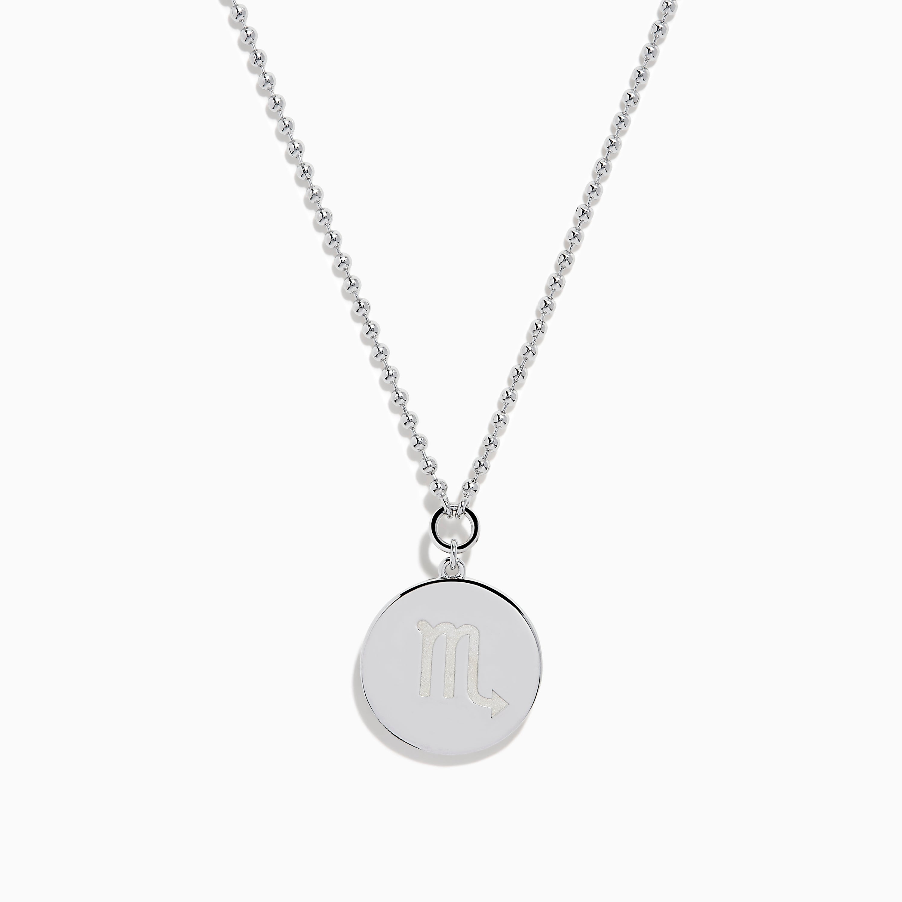The Zodiac 925 Sterling Silver and Diamond Scorpio Necklace features a round, textured pendant with an engraved scorpion design, hanging from a beaded chain against a white background.