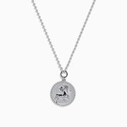 The Zodiac 925 Sterling Silver and Diamond Sagittarius Necklace features a round pendant with an engraved horse and rider, beaded edge design, and is perfect for Sagittarius lovers. Displayed on a white background.