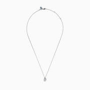 The Lab Grown Pear Diamond Bezel Pendant in 14K White Gold features a delicate silver chain and a pear-shaped lab grown diamond in an elegant bezel setting, showcased against a white background.