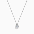 The Lab Grown Pear Diamond Bezel Pendant in 14K White Gold features a delicate silver chain and a pear-shaped lab grown diamond in an elegant bezel setting, showcased against a white background.