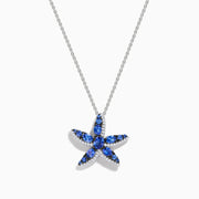 The 925 Silver Tanzanite and Diamond Starfish Pendant features a sparkling starfish design, adorned with tanzanite and diamonds, displayed against a white background.