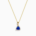 The Nahla Siri 14K Yellow Gold Tanzanite and Diamond Pendant features a triangular tanzanite accented by sparkling diamonds, set on a delicate gold chain against a white background.