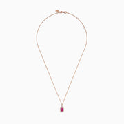 The 14K Rose Gold Pink Sapphire and Diamond Pendant features a rectangular pink sapphire, surrounded by diamonds, suspended from a delicate 14K rose gold chain against a white background.