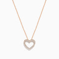 The Novelty 14K Rose Gold Diamond Heart Pendant features an open heart-shaped pendant with sparkling white stones on a delicate rose gold chain, shown on a plain white background.