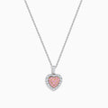 The 18K Two Tone Gold Pink and White Diamond Heart Pendant features sparkling pink center stones bordered by clear diamonds, creating a dazzling accessory perfect for any occasion.