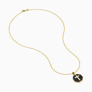 The 14K Yellow Gold Black Diamond Cross Pendant features an octagonal black diamond cross set in 14K yellow gold, shown against a white background.