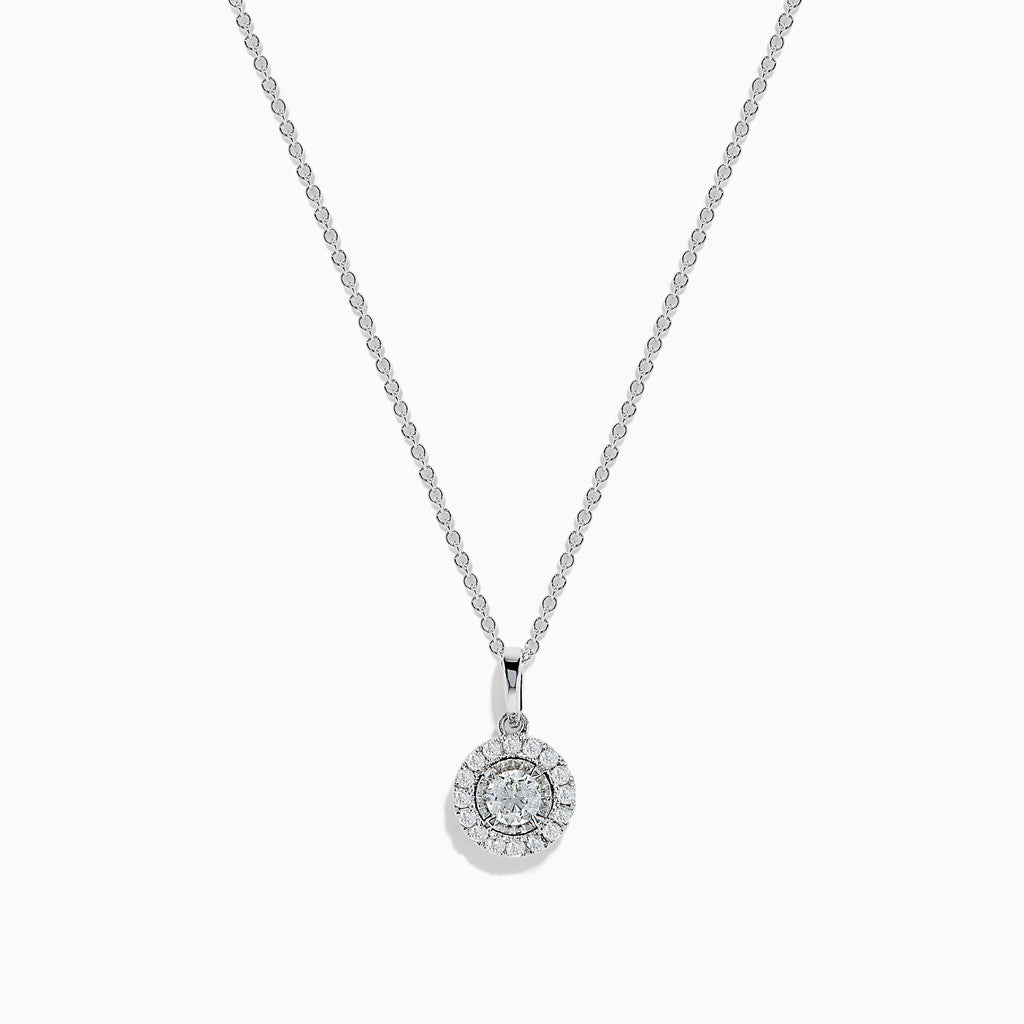 The Pave Classica 14K White Gold Diamond Halo Pendant (0.49 TCW) features a round center diamond with a sparkling halo, suspended from a delicate white gold chain. Displayed on a plain background, this piece reflects timeless elegance.