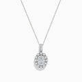 The Bouquet 14K White Gold Oval Diamond Pendant showcases an oval diamond encrusted with sparkling stones and a halo of round diamonds, elegantly displayed on a plain white background.