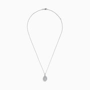 The Bouquet 14K White Gold Oval Diamond Pendant showcases an oval diamond encrusted with sparkling stones and a halo of round diamonds, elegantly displayed on a plain white background.