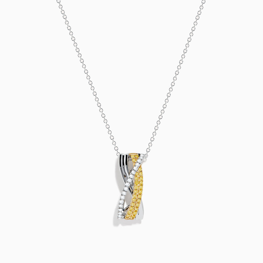 A delicate silver chain showcases the Canare 14K Two-Tone Gold Yellow and White Diamond Pendant, featuring two intertwined bands—one with yellow and white diamonds—set against a plain white background.