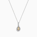The Canare 18K Two-Tone Gold Teardrop Pendant features a yellow diamond, white diamonds, and a single clear stone above, all elegantly set and hanging from a fine chain.