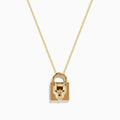 The Signature 14K Yellow Gold Black Diamond Lock Pendant features a padlock-shaped pendant with a sculpted animal face and black diamond accents, hanging from a delicate yellow gold chain on a white background.
