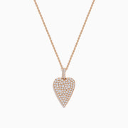 The Pave Rose 14K Rose Gold Diamond Heart Pendant features a heart-shaped pendant outlined in rose gold, encrusted with closely set sparkling diamonds for a brilliant, eye-catching finish.