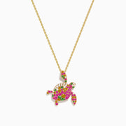 This 14K rose gold turtle pendant features pink and yellow sapphires, tsavorite, and sparkling diamonds for a dazzling look.