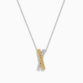 The 14K Two Tone Gold White and Yellow Diamond Criss Cross Pendant features an elegant X design with intersecting bars of white and yellow diamonds.