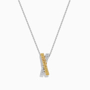 The 14K Two Tone Gold White and Yellow Diamond Criss Cross Pendant features an elegant X design with intersecting bars of white and yellow diamonds.