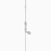 The 14K Two Tone Gold White and Yellow Diamond Criss Cross Pendant features an elegant X design with intersecting bars of white and yellow diamonds.