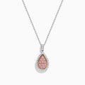 A 14K two tone gold pendant with a teardrop-shaped design, featuring pink and white diamonds at the center and surrounded by clear stones, hanging on a silver chain necklace.