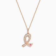 The Novelty 14K Rose Gold Pink Sapphire & Diamond Pink Ribbon Pendant features a diamond pink ribbon with clear gemstones and a single pink sapphire, displayed on a rose gold chain against a plain white background.