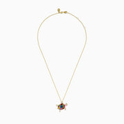 The Seaside 14K Yellow Gold Multi Sapphire and Diamond Turtle Pendant features sapphire gemstones on the shell and diamonds on the head and limbs, all hanging from a delicate gold chain.