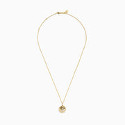 The Seaside 14K Yellow Gold Diamond Starfish Pendant features a round, textured yellow gold pendant with a diamond starfish design at the center and hangs from a delicate top-attached chain.