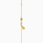 The Novelty 14K Yellow Gold Diamond Evil Eye Pendant features a round design with a raised sunburst and eye motif, accented by sparkling diamonds—an elegant twist on classic evil eye jewelry.