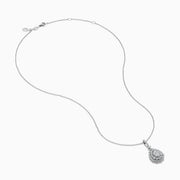 A 14K White Gold Diamond Pear Cluster Pendant featuring a delicate chain and a teardrop-shaped pendant adorned with sparkling diamonds in a floral pattern.