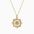 The 14K Yellow Gold Diamond Ship's Wheel Pendant features a ship’s wheel design, accented with sparkling diamonds set symmetrically along the spokes.