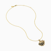 The 14K Yellow Gold Diamond Scallop Shell and Starfish Duo Pendant features a scallop shell and diamond-studded starfish on a fine gold chain, displayed against a white background.