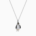 The Seaside 14K Two Tone Gold Diamond Penguin Pendant features black, white, and gold accents with sparkling diamond details for a charming look. Photographed against a plain white background.