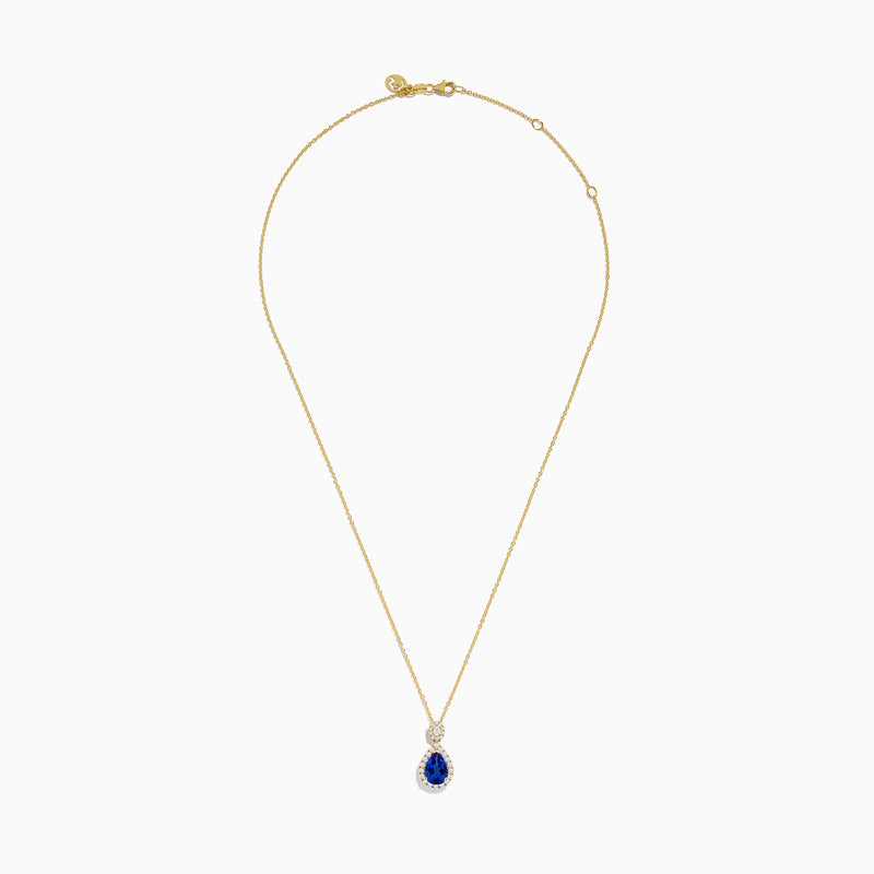 The Nahla Siri 14K Yellow Gold Tanzanite and Diamond Pendant features a teardrop blue tanzanite surrounded by white diamonds, plus a circular diamond accent above the main stone.