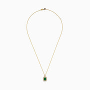 The Brasilica 14K Yellow Gold Emerald and Diamond Pendant showcases a rectangular emerald accented with sparkling diamonds, set against a plain white background.