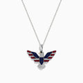 The Sterling Silver Black and White Diamond, Ruby and Sapphire Pendant features an eagle in flight with gemstones artfully arranged to evoke the American flag.