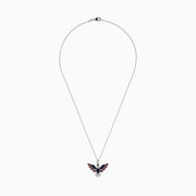 The Sterling Silver Black and White Diamond, Ruby and Sapphire Pendant features an eagle in flight with gemstones artfully arranged to evoke the American flag.