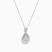 The Classique 14K White Gold Diamond Pendant features a teardrop-shaped diamond centerpiece, surrounded by sparkling diamonds in a sunburst design, suspended on a delicate white gold chain against a white background.